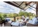 Relaxing covered balcony with comfortable seating and scenic views at 1952 Maritime Way, Atlanta, GA 30318