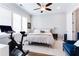 Bright bedroom with large windows, neutral decor, and an exercise bike at 1952 Maritime Way, Atlanta, GA 30318