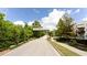 Welcoming entrance to Westside Station neighborhood, framed by lush greenery and a clear blue sky at 1952 Maritime Way, Atlanta, GA 30318