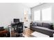 Home office with sofa, desk and adjacent bathroom at 1952 Maritime Way, Atlanta, GA 30318