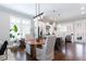 Bright, open kitchen area with hardwood floors, stainless steel appliances, and large windows at 1952 Maritime Way, Atlanta, GA 30318