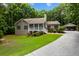 Charming single-Gathering home with a well-manicured front yard and inviting front porch at 6865 Fletcher Dr, Winston, GA 30187