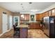 Eat-in kitchen with stainless appliances, granite counters and tile flooring at 6865 Fletcher Dr, Winston, GA 30187