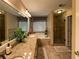 Bathroom boasts double vanity, granite counters, tub, and separate tile shower at 2380 Emerald Dr, Loganville, GA 30052