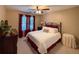 Bedroom with neutral walls, ceiling fan, and plush carpet at 2380 Emerald Dr, Loganville, GA 30052