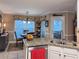 Bright kitchen featuring stainless appliances, granite counters, and an adjacent breakfast area at 2380 Emerald Dr, Loganville, GA 30052