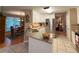 Bright kitchen with stainless appliances, granite counters and an adjacent dining area at 2380 Emerald Dr, Loganville, GA 30052