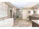 Spacious bathroom featuring dual vanities, freestanding tub and walk-in shower at 5178 S Trimble Rd, Atlanta, GA 30342