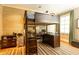 Unique bedroom design with a built-in loft bed and desk area, and a striped carpet at 5178 S Trimble Rd, Atlanta, GA 30342
