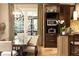 Open-concept dining area with dark wood table and chairs, built-in microwave, and views of the backyard at 5178 S Trimble Rd, Atlanta, GA 30342