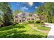 Charming stone and wood home with manicured lawn and lush landscaping at 5178 S Trimble Rd, Atlanta, GA 30342