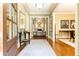 Elegant foyer showcasing hardwood floors, high ceilings, and seamless transition to adjoining living spaces at 5178 S Trimble Rd, Atlanta, GA 30342
