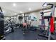 A home gym featuring a range of exercise equipment, fitness machines and a mirrored wall at 5178 S Trimble Rd, Atlanta, GA 30342