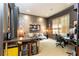 Stylish home office boasts unique wall decor, neutral colors, natural light and comfortable furnishings at 5178 S Trimble Rd, Atlanta, GA 30342