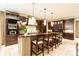 Bright and modern kitchen with beautiful mosaic backsplash, stainless appliances, and large island with seating at 5178 S Trimble Rd, Atlanta, GA 30342