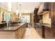 Spacious kitchen boasts granite countertops, stainless steel appliances, stone floors, and breakfast nook at 5178 S Trimble Rd, Atlanta, GA 30342