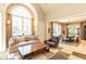 Bright living room boasting a large arched window and seamless flow into the adjacent dining area at 5178 S Trimble Rd, Atlanta, GA 30342