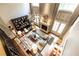 Bright living room with a fireplace, large windows, hardwood floors, and modern furnishings at 5178 S Trimble Rd, Atlanta, GA 30342