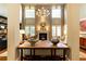 Bright living room with a soaring ceiling, fireplace, and large windows overlooking the yard at 5178 S Trimble Rd, Atlanta, GA 30342