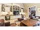 Open living room features built-in shelving, a large flat-screen TV, and stylish furniture and decor at 5178 S Trimble Rd, Atlanta, GA 30342