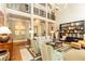 Beautiful living room with a soaring ceiling, fireplace, and elegant decor with a balcony view at 5178 S Trimble Rd, Atlanta, GA 30342