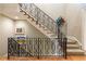 Elegant staircase features a black iron railing and hardwood treads at 5178 S Trimble Rd, Atlanta, GA 30342