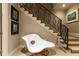 Finished basement stairs with custom iron railing and unique decor at 5178 S Trimble Rd, Atlanta, GA 30342