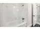 Bright bathroom featuring a white tiled shower-tub combination at 5180 Stone Trce, Stone Mountain, GA 30083