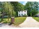 Beautiful two story house with a well-maintained front lawn and a paved driveway, adding to the property's curb appeal at 5180 Stone Trce, Stone Mountain, GA 30083