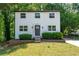 Charming two-story home with a well-manicured lawn, showcasing a blend of classic design and inviting curb appeal at 5180 Stone Trce, Stone Mountain, GA 30083