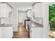 Modern kitchen with granite countertops, stainless steel appliances, and white cabinets at 5180 Stone Trce, Stone Mountain, GA 30083