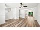 Spacious living area with wood floors leading to the kitchen and outdoor patio at 5180 Stone Trce, Stone Mountain, GA 30083