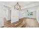 Open-concept living space with hardwood floors and white walls at 5180 Stone Trce, Stone Mountain, GA 30083
