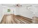 Open-concept living space with wood floors and white walls at 5180 Stone Trce, Stone Mountain, GA 30083