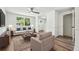 Cozy living room with comfortable seating, wood flooring, and plenty of natural light at 5180 Stone Trce, Stone Mountain, GA 30083