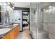 Bathroom featuring double vanity, walk-in shower, and a bedroom view at 127 Pebblebrook Way, Temple, GA 30179