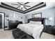 Primary bedroom featuring stylish accents, a ceiling fan, and ample natural light at 127 Pebblebrook Way, Temple, GA 30179