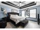 Bright bedroom with chic decor, a decorative ceiling, and stylish lighting at 127 Pebblebrook Way, Temple, GA 30179