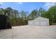 A three car garage with long driveway at 127 Pebblebrook Way, Temple, GA 30179