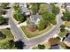 Aerial view of a beautiful home on a corner lot, surrounded by lush greenery and mature trees at 1485 Mill Place Dr, Dacula, GA 30019