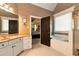 Inviting bathroom featuring a double vanity and a separate bathtub with a shower stall at 1485 Mill Place Dr, Dacula, GA 30019