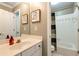 Charming bathroom with a white vanity, a tub, and a neutral shower curtain at 1485 Mill Place Dr, Dacula, GA 30019