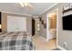 Comfortable bedroom with crown molding, and an ensuite bathroom with double sinks at 1485 Mill Place Dr, Dacula, GA 30019