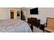 Cozy bedroom showcases a comfortable bed, dresser, and a chair with neutral walls at 1485 Mill Place Dr, Dacula, GA 30019