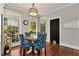 Cozy breakfast nook with wood table and views from large windows at 1485 Mill Place Dr, Dacula, GA 30019