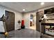 Exercise room with mirrored wall and doorway to other areas at 1485 Mill Place Dr, Dacula, GA 30019