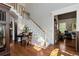 Inviting foyer with hardwood floors, staircase, and adjacent sitting room, offering a glimpse of comfortable living at 1485 Mill Place Dr, Dacula, GA 30019
