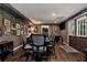 Entertaining game room with a poker table, hardwood floors, and framed artwork, ideal for social gatherings at 1485 Mill Place Dr, Dacula, GA 30019