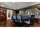 Elegant game room with a poker table, hardwood floors, dark walls with art and a cozy ambiance at 1485 Mill Place Dr, Dacula, GA 30019