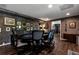 Stylish game room featuring a poker table, hardwood floors, dark walls, and a charming ambiance at 1485 Mill Place Dr, Dacula, GA 30019
